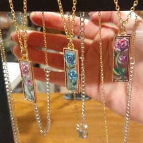 necklaces with flowers painted on them