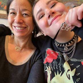 mother and daughter wearing handcrafted lotus necklaces